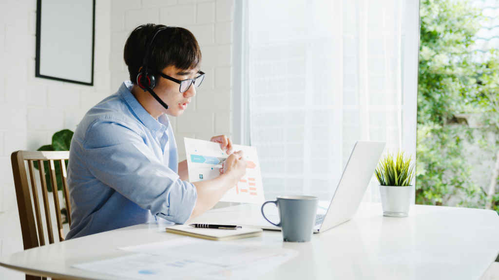 man using hybrid work for video conferencing